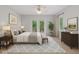 Inviting primary bedroom with neutral tones, a private balcony and natural light at 11226 Blackwalnut Pt, Indianapolis, IN 46236