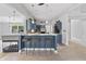 Modern kitchen with bar seating, granite countertops, a fireplace, and stainless steel appliances at 11226 Blackwalnut Pt, Indianapolis, IN 46236