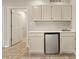 This kitchenette offers cabinets, countertop space, a mini-fridge, and a stainless steel sink at 11226 Blackwalnut Pt, Indianapolis, IN 46236