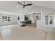 Spacious living area with open kitchen, bar seating, and modern fireplace at 11226 Blackwalnut Pt, Indianapolis, IN 46236