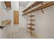 Organized walk-in closet with custom shelving and storage solutions, ensuring ample space at 11226 Blackwalnut Pt, Indianapolis, IN 46236