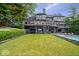 Expansive backyard with lush greenery and a luxurious pool area, ideal for relaxation at 11715 Landings Dr, Indianapolis, IN 46256