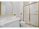 Well-maintained bathroom features a single vanity, toilet, and shower with sliding glass doors at 11715 Landings Dr, Indianapolis, IN 46256