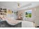 Bright bedroom with built-in bookshelves, a desk, and plush carpeting at 11715 Landings Dr, Indianapolis, IN 46256