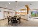 Open dining area with bar, wooden accents, storage cubby, and comfortable seating at 11715 Landings Dr, Indianapolis, IN 46256