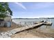 Picturesque lakeside dock with a charming lighthouse structure at 11715 Landings Dr, Indianapolis, IN 46256