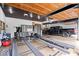 Spacious garage featuring custom cabinets, room for vehicles, and a trailer storage area at 11715 Landings Dr, Indianapolis, IN 46256