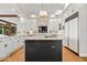 Well-appointed kitchen with a center island, custom cabinets, and modern appliances for functionality at 11715 Landings Dr, Indianapolis, IN 46256