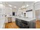 Spacious kitchen with large center island, custom cabinetry, and stainless steel appliances at 11715 Landings Dr, Indianapolis, IN 46256