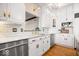 Bright kitchen features white cabinetry, marble countertops, and stainless steel appliances at 11715 Landings Dr, Indianapolis, IN 46256