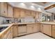 Charming kitchen features wooden cabinetry, modern appliances, and ample counter space at 11715 Landings Dr, Indianapolis, IN 46256