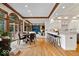 Inviting open-concept living space with hardwood floors, fireplace and views of lake at 11715 Landings Dr, Indianapolis, IN 46256
