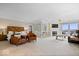 Expansive main bedroom featuring a fireplace, sitting area, and access to a private balcony with scenic views at 11715 Landings Dr, Indianapolis, IN 46256