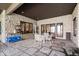 Outdoor stone patio with seating area and views of the lake at 11715 Landings Dr, Indianapolis, IN 46256