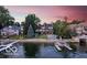 Spectacular waterfront home with private beach, boat dock, and lush greenery in a serene setting at 11715 Landings Dr, Indianapolis, IN 46256