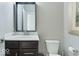 Clean and modern bathroom with a vanity, mirror, and toilet at 13217 E 131St St, Fishers, IN 46037