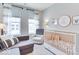 Charming Bedroom with a crib, comfortable seating, and serene decor at 13217 E 131St St, Fishers, IN 46037