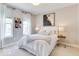 Cozy bedroom with a queen-sized bed, soft lighting, and tasteful artwork at 13217 E 131St St, Fishers, IN 46037