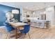 Stylish dining area and adjacent kitchen with stainless appliances, showcasing an open and flowing floor plan perfect for entertaining at 13217 E 131St St, Fishers, IN 46037