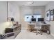 Well-lit home office featuring a modern desk, dual monitors, and stylish decor at 13217 E 131St St, Fishers, IN 46037