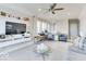 Spacious living room featuring a large TV, comfortable seating, and a ceiling fan at 13217 E 131St St, Fishers, IN 46037