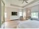 Spacious main bedroom featuring a dresser, seating area, and large windows for natural light at 13217 E 131St St, Fishers, IN 46037
