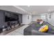 Finished basement featuring a pool table, sofa, and large television at 14075 Knightstown E Dr, Carmel, IN 46033