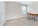 Neutral bedroom featuring carpet, a window, and space for a study desk at 14075 Knightstown E Dr, Carmel, IN 46033