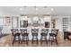 Bright kitchen features a large island with seating, stainless steel appliances, and pendant lighting at 14075 Knightstown E Dr, Carmel, IN 46033