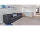 Upstairs living room featuring a comfortable gray sofa and cozy atmosphere at 14075 Knightstown E Dr, Carmel, IN 46033