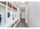 Well-organized mudroom with built-in storage, cubbies, and bench seating at 14075 Knightstown E Dr, Carmel, IN 46033