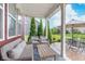 Covered patio with modern furniture is perfect for outdoor entertaining at 14075 Knightstown E Dr, Carmel, IN 46033