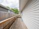 Exterior view of the side yard and a wooden ramp leading to a door at 1415 Lawton Ave, Indianapolis, IN 46203
