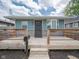 Charming home featuring a spacious wooden front porch with a mailbox and steps leading up to the inviting entrance at 1415 Lawton Ave, Indianapolis, IN 46203