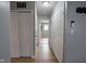 A hallway with several doors, recessed lighting, and hardwood floors at 1415 Lawton Ave, Indianapolis, IN 46203