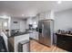 Bright kitchen with stainless steel refrigerator, countertop island, and modern finishes at 1415 Lawton Ave, Indianapolis, IN 46203