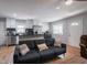 Bright living space leading to modern kitchen, showcasing an open layout with stainless steel appliances and stylish decor at 1415 Lawton Ave, Indianapolis, IN 46203