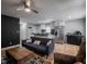 Inviting living space with hardwood floors seamlessly connecting to a modern kitchen with stainless steel appliances at 1415 Lawton Ave, Indianapolis, IN 46203