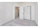 Bedroom with plush neutral carpet and a closet for convenient storage, providing an organized space at 14515 Hanford Ln, Carmel, IN 46074