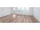 Living room with hardwood floors, natural light and a glass panel back door at 14515 Hanford Ln, Carmel, IN 46074