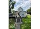 Backyard featuring a deck, well-maintained lawn and mature trees at 1517 S Reisner St, Indianapolis, IN 46221