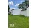 Spacious backyard with well-manicured lawn and two storage sheds at 1517 S Reisner St, Indianapolis, IN 46221