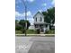 View of a quaint two-story home featuring a white picket fence at 1517 S Reisner St, Indianapolis, IN 46221