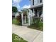 View of home featuring a white gate and flowers at 1517 S Reisner St, Indianapolis, IN 46221