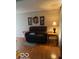 Comfortable living room with hardwood floors, a plush sofa and neutral decor at 1517 S Reisner St, Indianapolis, IN 46221