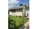 View of detached shed in backyard with double doors and mature landscaping at 1517 S Reisner St, Indianapolis, IN 46221