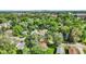 Lush greenery surrounds the homes in this aerial view, showcasing a serene residential neighborhood with mature trees at 1523 E Mills Ave, Indianapolis, IN 46227