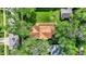 Overhead view of a property, showcasing a lush backyard with fire pit and wooden ramp access at 1523 E Mills Ave, Indianapolis, IN 46227