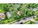 Aerial view of the house nestled among mature trees, offering a sense of privacy at 1523 E Mills Ave, Indianapolis, IN 46227