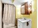 A bathroom featuring a vanity with mirror and shower curtain at 1523 E Mills Ave, Indianapolis, IN 46227